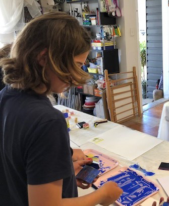 Student making lino prints